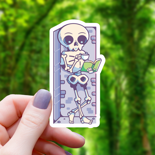 Chilling Skeleton Reading a Book Sticker - 3"